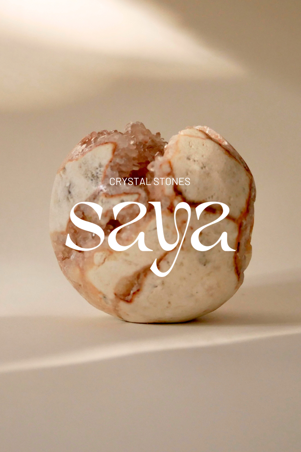 SAYA brand introduction with sculptural lettering and pink quartz imagery
